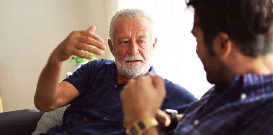 Photo: Two men in conversation