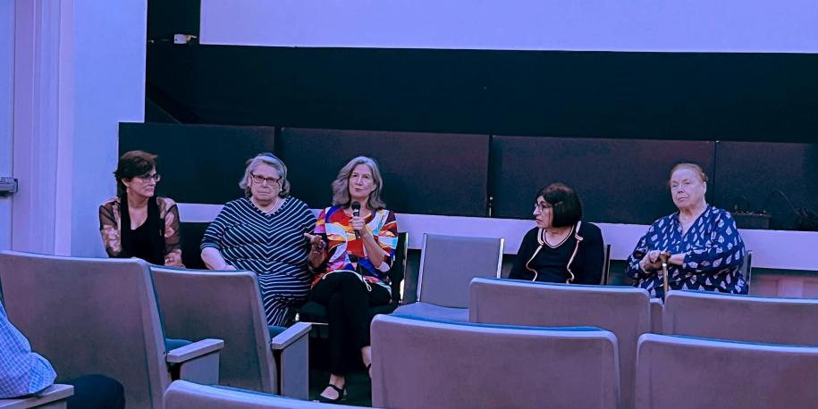 Five of the abortion dialogue participants, one holding a microphone